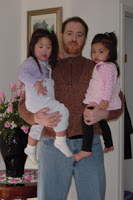 Robert Stanek at home with his daughters